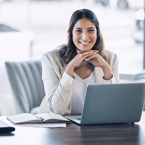 Smiling woman at an office desk
