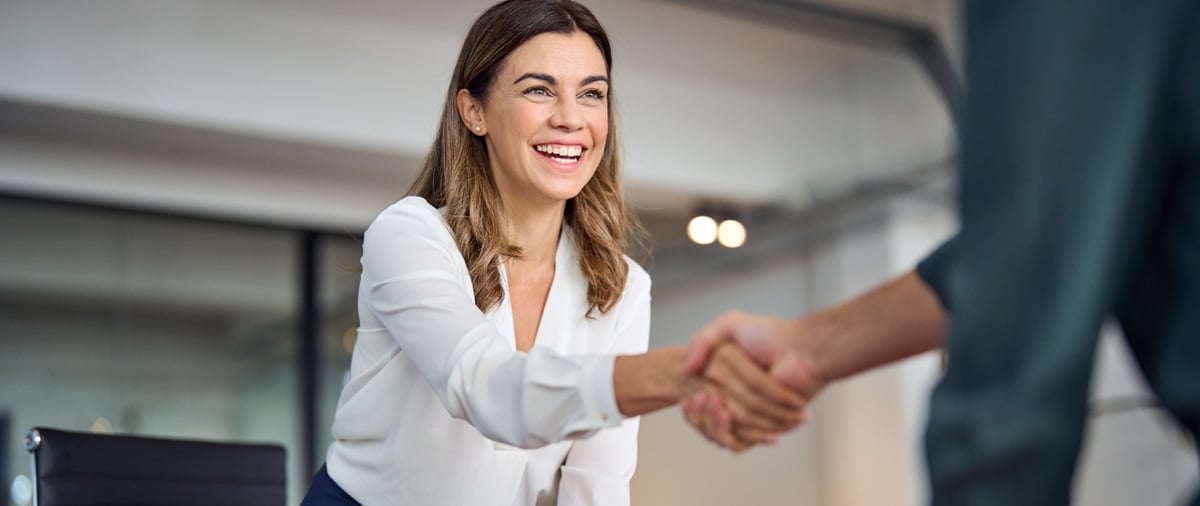 business woman giving a handshake