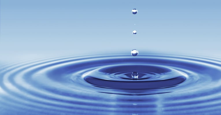Water drops landing in water