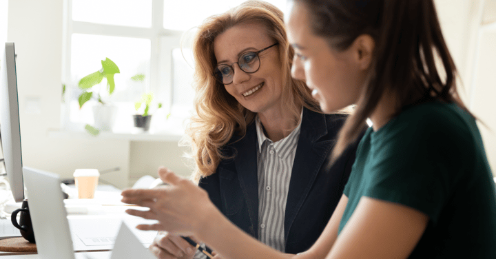 Two women looking at commuter