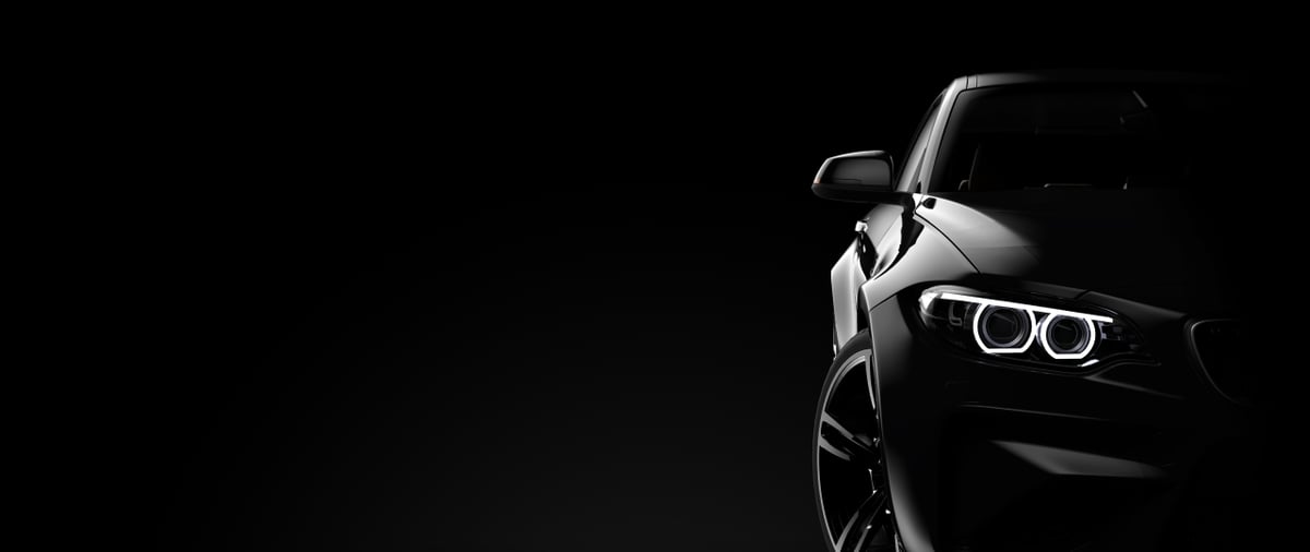 Modern black car on dark background