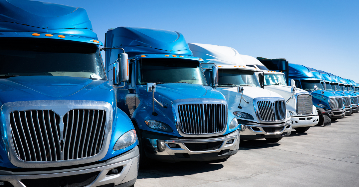 Row_of_blue_trucks_at_dealership