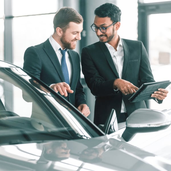 Square_two men looking at data on tablet in car shop