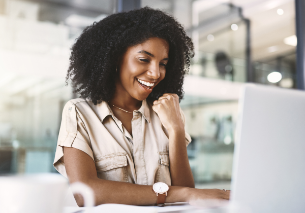 woman-at-laptop-happy-solving-challenges-targit